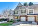Attractive townhome with a two-car garage and well-maintained landscaping at 8929 Bryant Field Cir, Charlotte, NC 28277