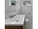 Clean bathroom with a modern sink, faucet, and white tile flooring at 924 Springdale Ln, Gastonia, NC 28052