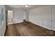 Empty bedroom featuring hardwood floors, a closet, ensuite bathroom and neutral walls at 924 Springdale Ln, Gastonia, NC 28052