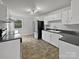 Well-lit kitchen with stainless steel appliances, white cabinets, and sleek countertops at 924 Springdale Ln, Gastonia, NC 28052