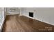 Spacious living room with hardwood floors, a fireplace, and large windows for lots of natural light at 924 Springdale Ln, Gastonia, NC 28052