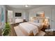 Staged primary bedroom featuring a king bed, ensuite bathroom, closet, and modern decor at 924 Springdale Ln, Gastonia, NC 28052