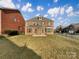 Spacious backyard with a well-maintained lawn and privacy fence at 9503 Rocky Spring Nw Ct, Concord, NC 28027