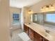 Well-lit bathroom with double vanity, tile floors, and separate shower and tub at 9503 Rocky Spring Nw Ct, Concord, NC 28027