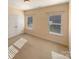 Sunlit bedroom with carpeted floors and natural light at 9503 Rocky Spring Nw Ct, Concord, NC 28027