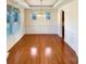 Dining room features hardwood floors, wainscoting and a decorative chandelier at 9503 Rocky Spring Nw Ct, Concord, NC 28027