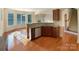 Open kitchen with stainless steel appliances and a breakfast bar at 9503 Rocky Spring Nw Ct, Concord, NC 28027