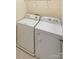 Laundry room features a white washing machine and dryer at 9503 Rocky Spring Nw Ct, Concord, NC 28027