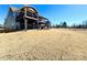 Expansive backyard featuring a two-story deck, perfect for outdoor entertaining and relaxation on a sunny day at 9677 Garamont Nw Pkwy, Concord, NC 28027