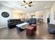 Upstairs living area with hardwood floors, ceiling fan, and comfortable seating furniture at 9677 Garamont Nw Pkwy, Concord, NC 28027