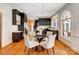 Dining area featuring hardwood floors, designer furnishings and plenty of natural light at 10207 Rattersly Ct, Charlotte, NC 28277