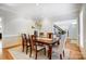Classic dining room featuring a wooden table with seating for six and hardwood flooring at 10207 Rattersly Ct, Charlotte, NC 28277
