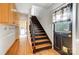 Inviting entryway showcasing hardwood floors, staircase, and access to the laundry room at 10207 Rattersly Ct, Charlotte, NC 28277