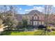 Charming two-story brick home with well-manicured landscaping and a welcoming light-blue front door at 10207 Rattersly Ct, Charlotte, NC 28277