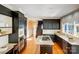 Spacious kitchen with granite countertops, stainless steel appliances, and hardwood floors at 10207 Rattersly Ct, Charlotte, NC 28277