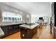 Kitchen with granite counters and eat in island, hardwood floors, and open floor plan at 10207 Rattersly Ct, Charlotte, NC 28277