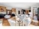 Open-concept living room with hardwood floors and designer furnishings at 10207 Rattersly Ct, Charlotte, NC 28277