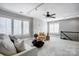 Cozy living room features plantation shutters, recessed lights, ceiling fan, and neutral decor at 10207 Rattersly Ct, Charlotte, NC 28277