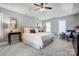 Spacious main bedroom with tray ceiling, recessed lighting, and plantation shutters on the windows at 10207 Rattersly Ct, Charlotte, NC 28277