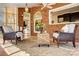 Relaxing sunroom with brick and abundant windows to the rest of the home and the exterior at 10207 Rattersly Ct, Charlotte, NC 28277