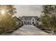 Stunning exterior view of a two-story home with a stone driveway and manicured landscaping at 1025 Maxwell Ct # 7, Marvin, NC 28173