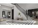 Bright foyer featuring checkerboard tile, staircase with black iron railing, and an abundance of natural light at 1025 Maxwell Ct # 7, Marvin, NC 28173