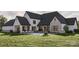 Lush backyard featuring a refreshing pool, outdoor seating, and a covered porch for luxurious outdoor living at 1057 Maxwell Ct # 13, Marvin, NC 28173