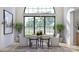 Sunlit dining room boasting large windows with picturesque outdoor views and elegant decor at 1057 Maxwell Ct # 13, Marvin, NC 28173
