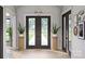 A spacious foyer welcomes guests with an elegant double door, decorative plants, and stylish decor at 1057 Maxwell Ct # 13, Marvin, NC 28173