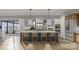 Spacious kitchen featuring a large island with seating, custom cabinets, and modern appliances for the ultimate culinary experience at 1057 Maxwell Ct # 13, Marvin, NC 28173