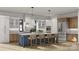 A modern kitchen featuring a large island with seating, stainless steel appliances, and a neutral color palette at 1057 Maxwell Ct # 13, Marvin, NC 28173