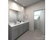 Elegant bathroom features double vanity, sleek mirrors, and well-lit interiors at 114 Ciara Pl # A, Mooresville, NC 28117