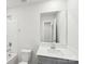 Well lit bathroom featuring tub, shower and large mirror at 114 Ciara Pl # A, Mooresville, NC 28117