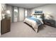 Cozy bedroom with neutral tones, soft carpet, and serene decor at 114 Ciara Pl # A, Mooresville, NC 28117