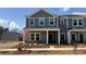 Charming new construction townhome with gray siding and covered front porch, ready for move-in at 114 Ciara Pl # A, Mooresville, NC 28117