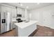 Kitchen with stainless steel appliances, white cabinets, and center island at 114 Ciara Pl # A, Mooresville, NC 28117