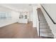 Spacious living room with wood flooring and staircase at 114 Ciara Pl # A, Mooresville, NC 28117