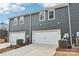 Exterior of two-story home features gray siding and attached two-car garages at 114 Ciara Pl # B, Mooresville, NC 28117