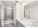 Bathroom features a double sink vanity, a walk-in shower, and a large mirror, designed for comfort at 114 Ciara Pl # C, Mooresville, NC 28117