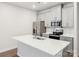 Bright kitchen featuring a large island with white countertops and light gray cabinetry and stainless steel appliances at 114 Ciara Pl # C, Mooresville, NC 28117