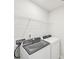 Well-equipped laundry room with modern washer and dryer, and practical storage shelving at 114 Ciara Pl # C, Mooresville, NC 28117