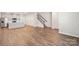 Open floor plan offers wood-look flooring and blends the living room with the kitchen in this contemporary space at 114 Ciara Pl # C, Mooresville, NC 28117