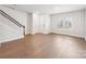 Spacious living room featuring hardwood floors, staircase, and natural light at 114 Ciara Pl # C, Mooresville, NC 28117