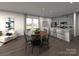 Open-concept living and dining area with a kitchen island, dining table, and modern decor at 114 Ciara Pl # C, Mooresville, NC 28117