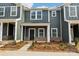 Charming townhome featuring a covered entryway and neutral exterior at 114 Ciara Pl # E, Mooresville, NC 28117