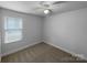 Cozy bedroom with carpet, ceiling fan, and a window providing natural light at 118 W Lee Ave, Bessemer City, NC 28016