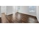 Bright bedroom features neutral carpet, white walls, and a large window at 118 W Lee Ave, Bessemer City, NC 28016