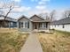 Charming gray home with a covered front porch and well-maintained lawn at 118 W Lee Ave, Bessemer City, NC 28016