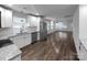 Bright kitchen featuring white cabinets, stainless steel appliances, and open layout at 118 W Lee Ave, Bessemer City, NC 28016