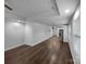 Open-concept living room with hardwood floors, recessed lighting, and ample natural light at 118 W Lee Ave, Bessemer City, NC 28016